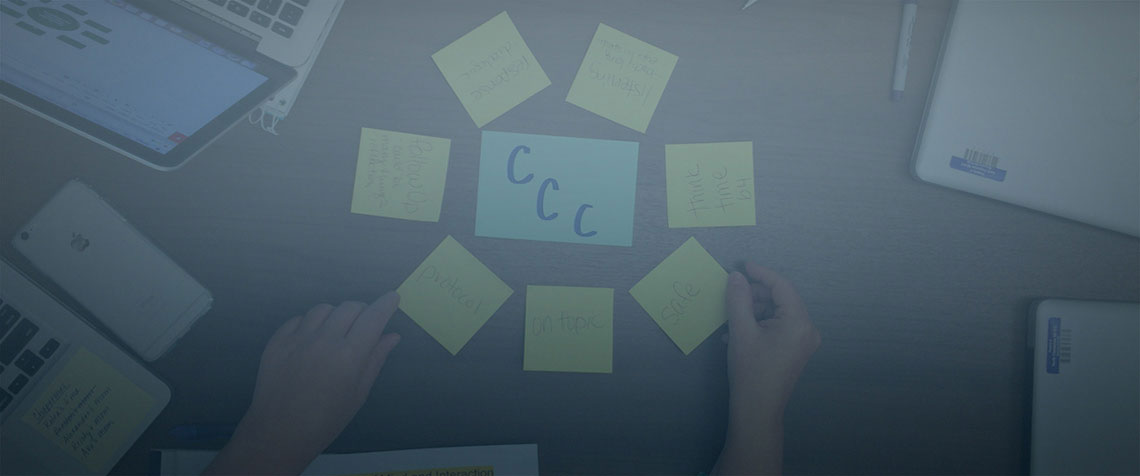 student writing at her desk